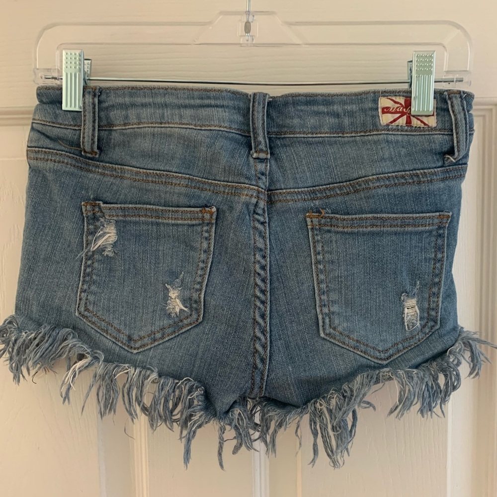 denim fringe shorts